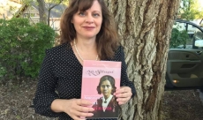 April Young Bennett with her book, Ask a Suffragist